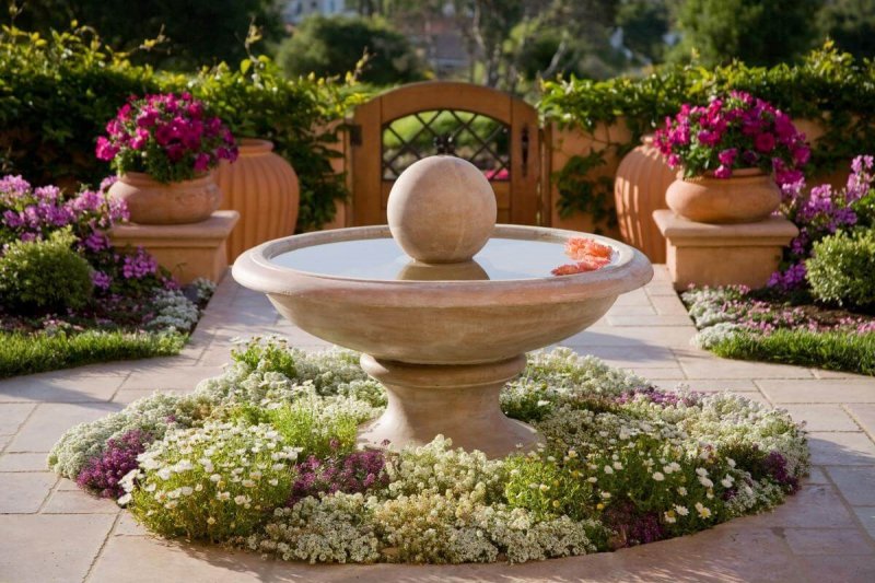 15. Graceful Mediterranean-Inspired Fountain Bed